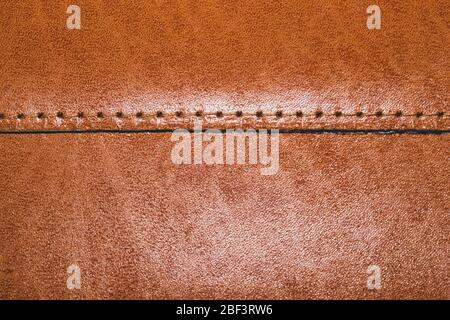 Brown leather texture with a linear stitch. material with seam Stock Photo