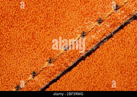 Brown leather texture with a linear stitch. material with seam Stock Photo