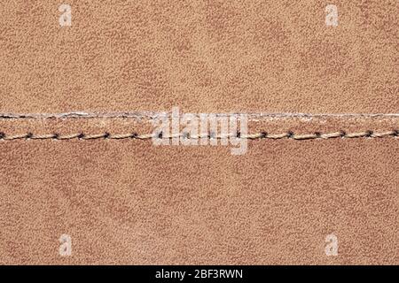 Brown leather texture with a linear stitch. material with seam Stock Photo