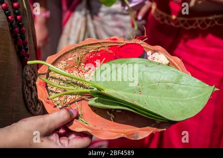 A Women holding a borondala (Pooja thali for worshipping God) in Sindur Khela at a puja pandal on the last day of Durga puja. Stock Photo