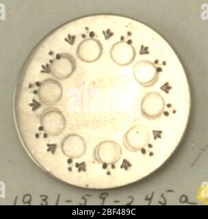 Button. A & B) decorated with engraving and punch work; C) is dish-shaped with facetted bass in center; D) has beveled rim and shallow central depression; E) has scalloped edge with two rings of pierced decoration.On card 65 Stock Photo