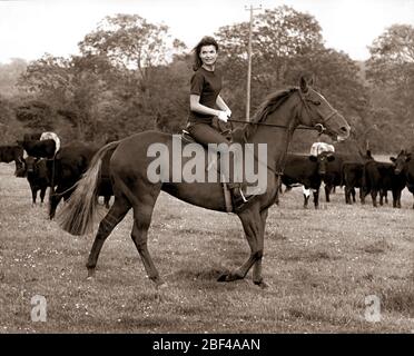 Former First Lady of the United States First Lady JACQUELINE KENNEDY and daughter Caroline horseback riding. Stock Photo