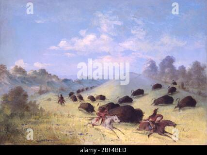 Comanche Indians Chasing Buffalo with Lances and Bows. George Catlin enjoyed and documented buffalo hunts with various tribes, describing methods such as the exhilarating but dangerous chase on horseback, the surround, and the ambush, in which hunters crept among the unsuspecting herds disguised under the skin of a white wolf for a c Stock Photo