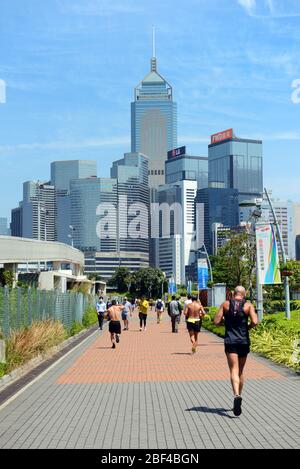 Jogging through Tamar park in Admiralty, Hong Kong. Stock Photo