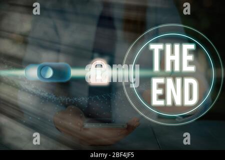 Writing note showing The End. Business concept for Final part of play relationship event movie act Finish Conclusion Stock Photo