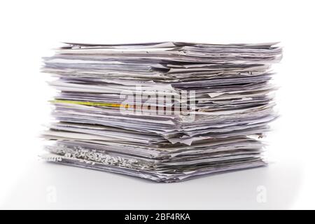 Large pile of waste paper isolated on white. Ready for recycling Stock Photo