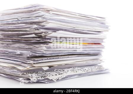 Large pile of waste paper isolated on white. Ready for recycling Stock Photo