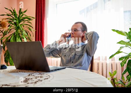 Businessman talking on phone. Home office. Stock Photo
