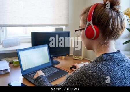 Young woman learning from home Stock Photo
