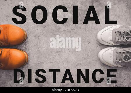 Two person stay away each other keeping Social distance , to protecting from global coronavirus covid-19 spread Stock Photo