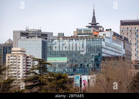 Buildings in seen from Ritan Park - Temple of the Sun Park in Chaoyang District, Beijing, China Stock Photo