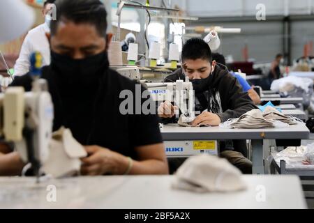 Los Angeles, USA. 17th Apr, 2020. Workers make face masks at a face mask factory transformed from a 16,000 square-foot apron factory amid the COVID-19 pandemic in the City of Vernon, Los Angeles County, California, the United States, April 16, 2020. Credit: Xinhua/Alamy Live News Stock Photo