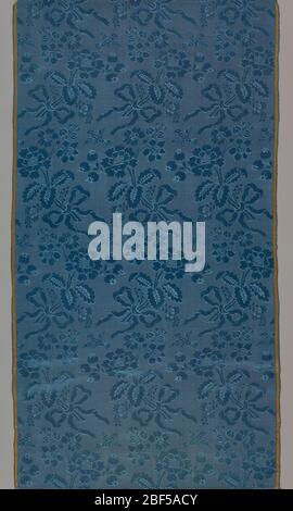 Textile. Dark blue taffeta with a pattern of bouquets of flowers. Stock Photo