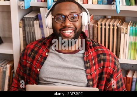 African-American student preparing for exam in library Stock Photo