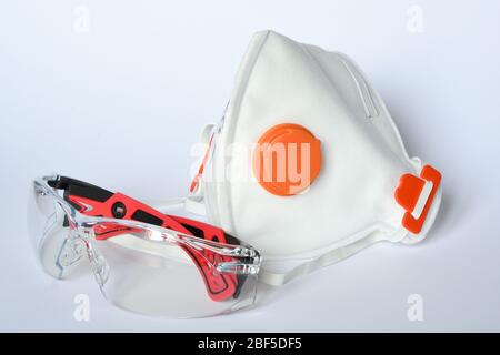 Protection Mask KN95 ffp3 with glasses against dust and corona viruses (COVIT-19) placed on a white background Stock Photo