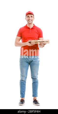 Handsome delivery man with pizza on white background Stock Photo
