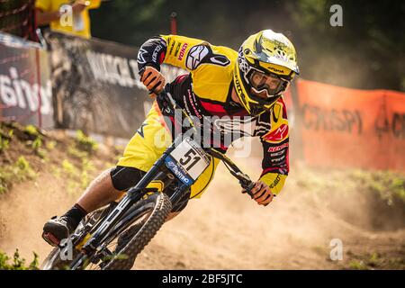 VAL DI SOLE, TRENTINO, ITALY - AUGUST 22, 2015. Mick Hannah (AUS) racing for Team Polygon UR at the UCI Mountain Bike Downhill World Cup Stock Photo