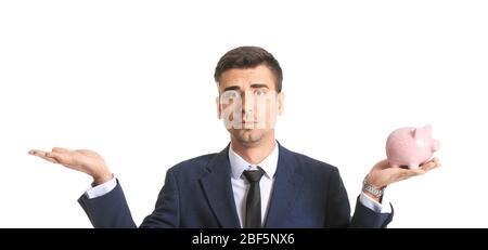 Sad male bank manager with piggy bank on white background Stock Photo
