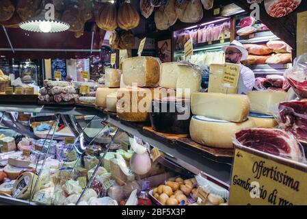 Meat and cheese for sale on Mercato di Mezzo food market in Bologna, capital and largest city of the Emilia Romagna region in Northern Italy Stock Photo