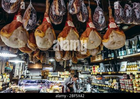 Prosciutto di San Daniele hams on Mercato di Mezzo food market in Bologna, capital and largest city of the Emilia Romagna region in Italy Stock Photo