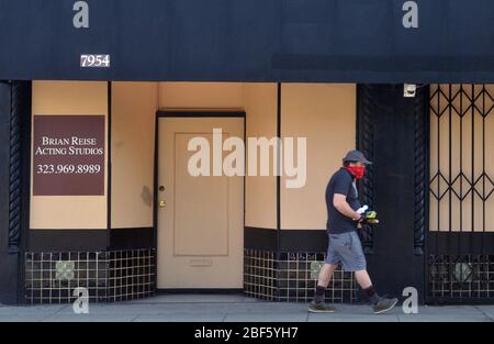 Pasadena, United States. 17th Apr, 2020. A man walks past a boarded up acting studio in West Hollywood on Thursday, April 16, 2020. Trump unveiled a plan to reopen state economies in the coming months in phases, reassuring them they would be handling it themselves, with help from the federal government. Photo by Jim Ruymen/UPI Credit: UPI/Alamy Live News