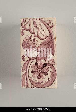 Tile. Vertical rectangles. Each tile with identical pattern of two flowers and leaves on continuous scrolling stem. One flower faces the observer and the other is in profile. Manganese violet on white ground. Stock Photo