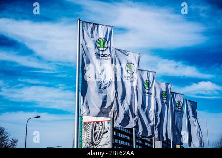 Flags of Czech carmaker Skoda Auto fly in the wind in front of Czech carmaker Skoda Auto Museum in Mlada Boleslav, Czech Republic, on Thursday, April Stock Photo