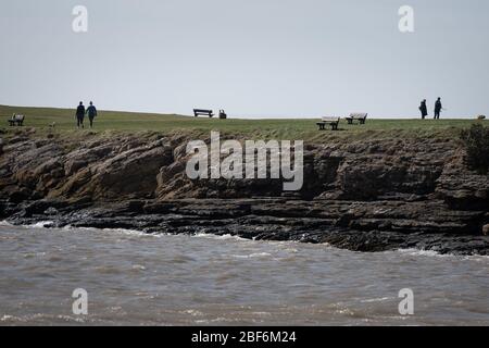 Barry Island, Vale of Glamorgan, Wales, UK. 13th April 2020. Locals at Barry Island in south Wales help reduce the spread of COVID-19 by utilising soc Stock Photo