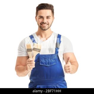 Young painter showing thumb-up on white background Stock Photo