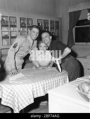 BURT LANCASTER DEBORAH KERR and Director FRED ZINNEMANN on set candid during filming of FROM HERE TO ETERNITY 1953 novel James Jones screenplay Daniel Taradash Columbia Pictures Stock Photo