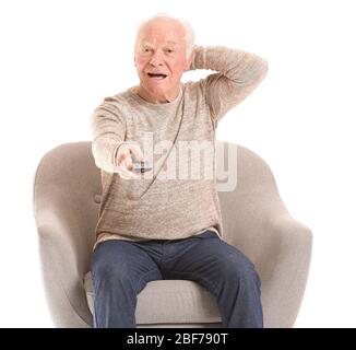 Portrait of elderly man watching TV on white background Stock Photo