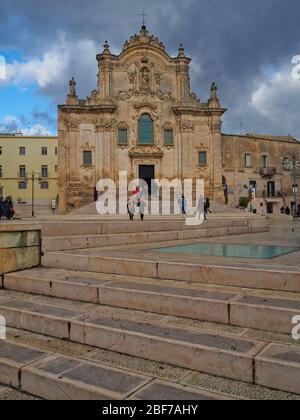 A church among the houses of the ancient city of Matera in Italy Stock Photo