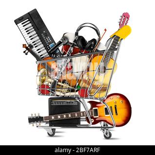 stack pile collage of various musical instruments in shopping cart. Electric guitar violin piano keyboard bongo  tamburin harmonica trumpet. store onl Stock Photo