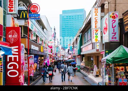 Tokyo, Japan - Febuary 23, 2017: Crowded people in the beautiful and famous Shinjuku neighborhood. More than three hundred thousand people live in Stock Photo