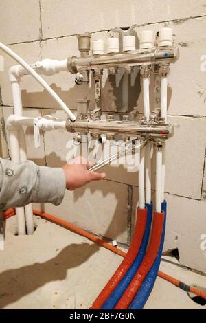 Underfloor heating is mounted on a pipeline installer, heating system and underfloor heating.2020 Stock Photo