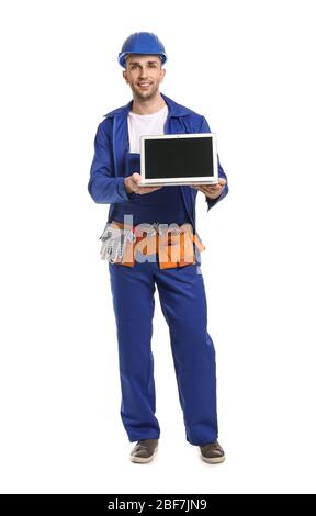 Handsome male worker with laptop on white background Stock Photo