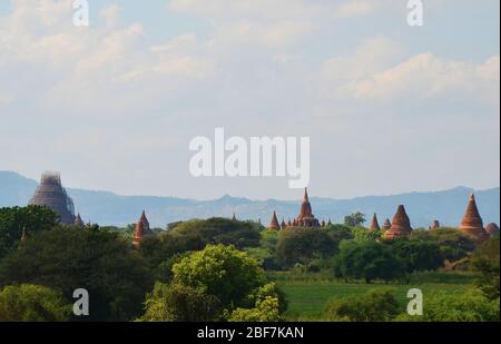 Red bricked temples in central plain Bagan Myanmar I Stock Photo