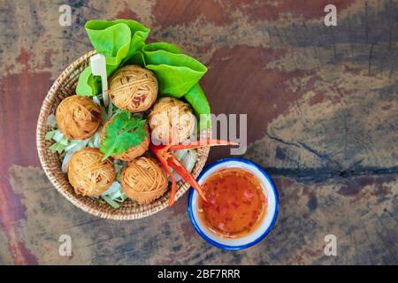 Deep fried wrapped pork with noodle, traditional thai food Stock Photo