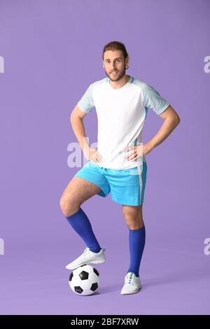 Male football player on color background Stock Photo - Alamy