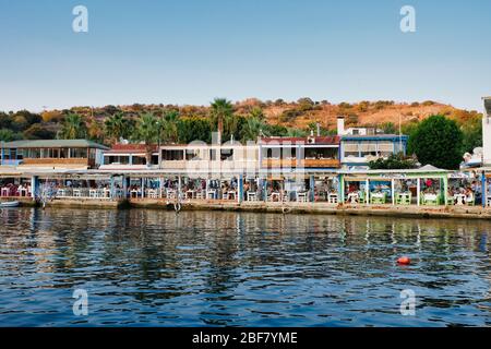 Mimoza, Gumusluk Bodrum Sunset accompanied by a delicious fish restaurant. Stock Photo