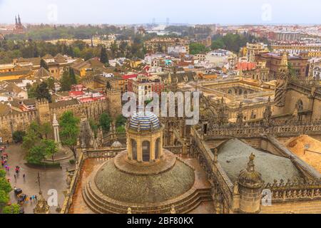 Aerial view of Seville skyline, Seville Cathedral of Saint Mary of the See from Giralda tower, Plaza del Triunfo or triumph square and walls and Stock Photo