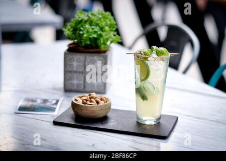 Refreshed Mojito cocktail with Cookie on the marble table. Summer exotic colorful cocktail Stock Photo