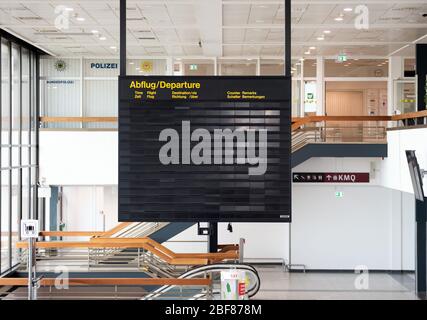 09 April 2020, Brandenburg, Schönefeld: An empty display board hangs in the departure terminal L at Schoenefeld Airport in front of the access to the security control. Due to the danger posed by the spread of Covid-19, there are entry restrictions in many countries and, as a result, significant restrictions on air traffic. Photo: Soeren Stache/dpa-Zentralbild/ZB Stock Photo