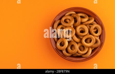 Russian bagels, bread rings on color background with copy space, top view Stock Photo