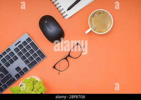 Keyboard, computer mouse and cofffe on yellow background Stock Photo