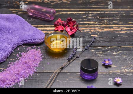Spa items and honey on dark wooden background Stock Photo