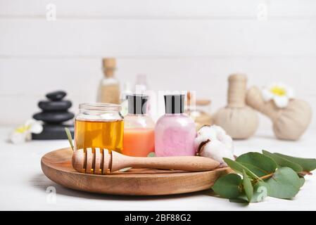 Cosmetics with honey on white wooden background Stock Photo