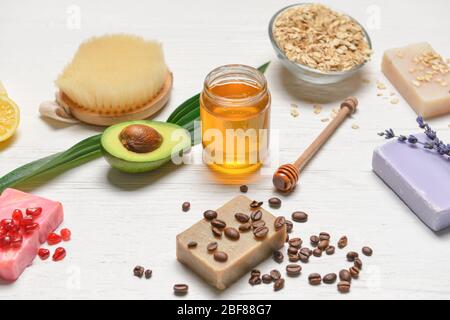 Spa items and honey on white wooden background Stock Photo
