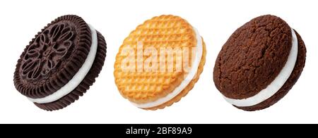 Chocolate sandwich cookies, baked biscuits stuffed with milk cream isolated on white background Stock Photo