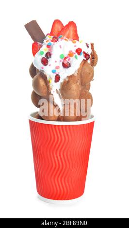 Delicious sweet bubble waffle in cup on white background Stock Photo